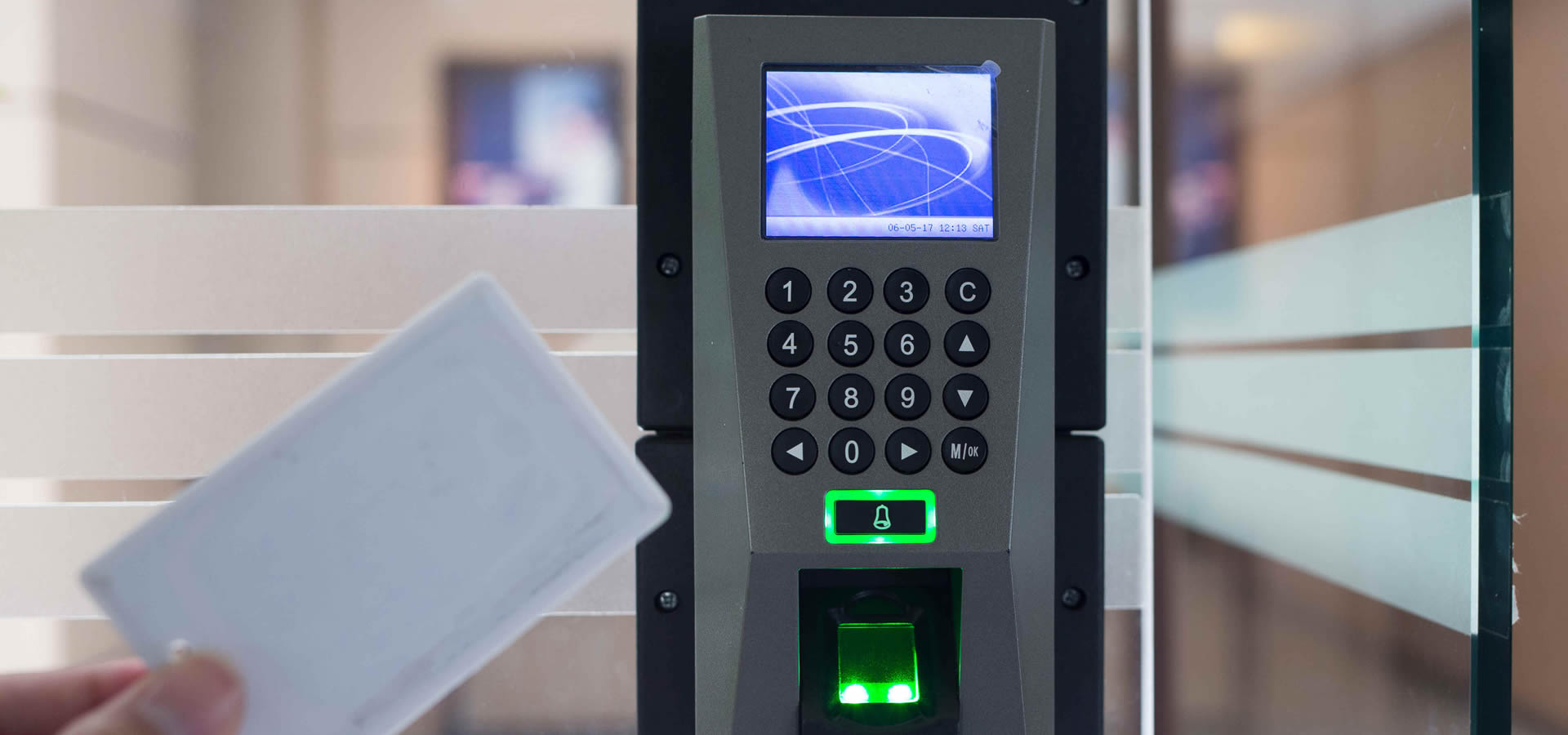 Access control system with keypad and LCD display mounted on glass door